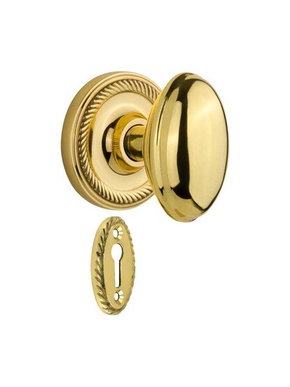 Rope Rosette Mortise-Lock Set with Homestead Knobs in Polished Brass.